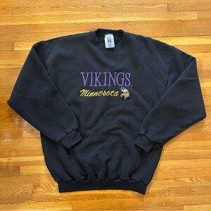 LOGO 7 Black Crewneck Sweatshirt with Purple and Gold Minnesota Vikings Design
